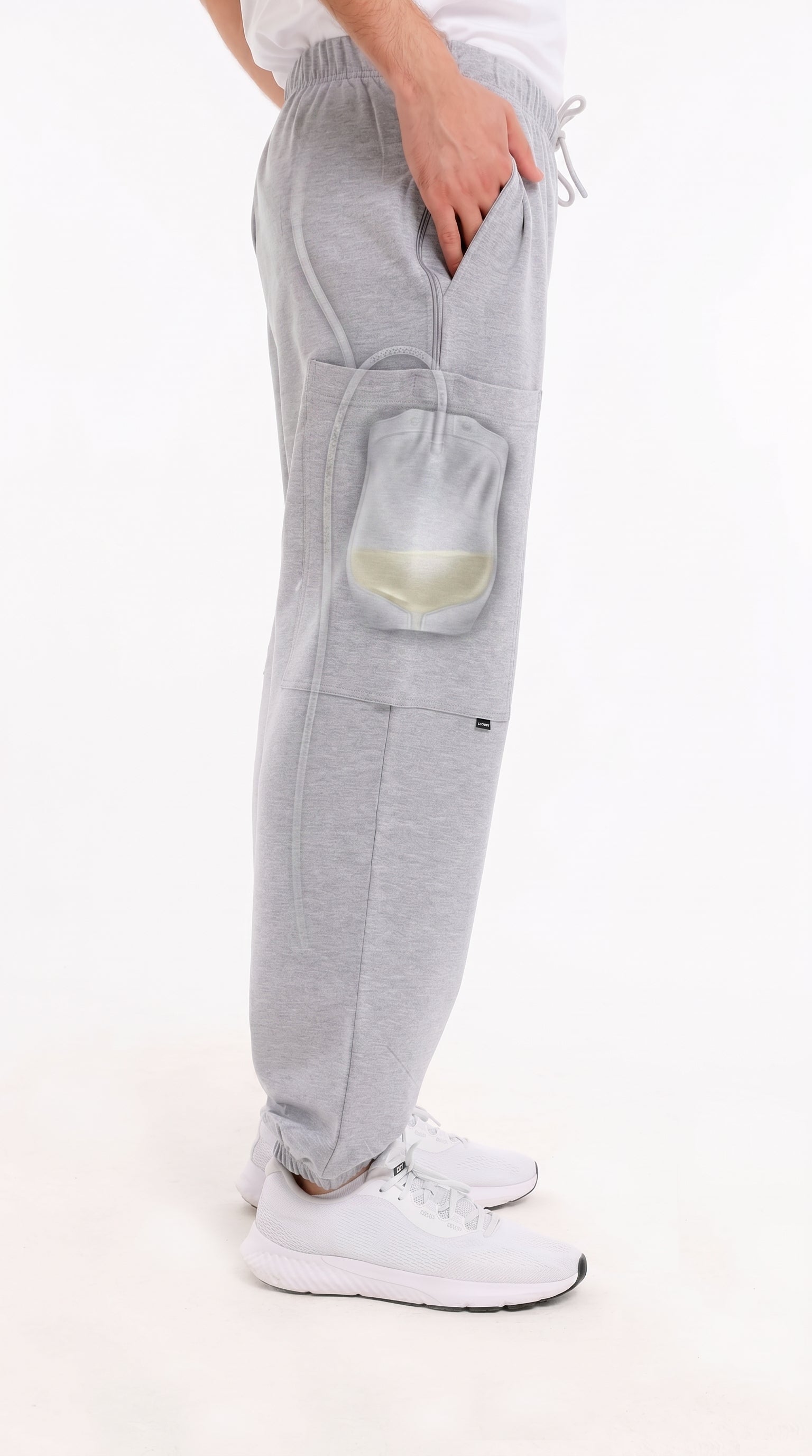 ComfortCure Adaptive Pflegehose für Prostatapatienten (mit Beintaschen), Grau meliert, Seitenansicht der Beintasche mit Röntgenansicht des Urinbeutels